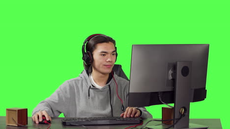 Asian-player-gaming-on-computer